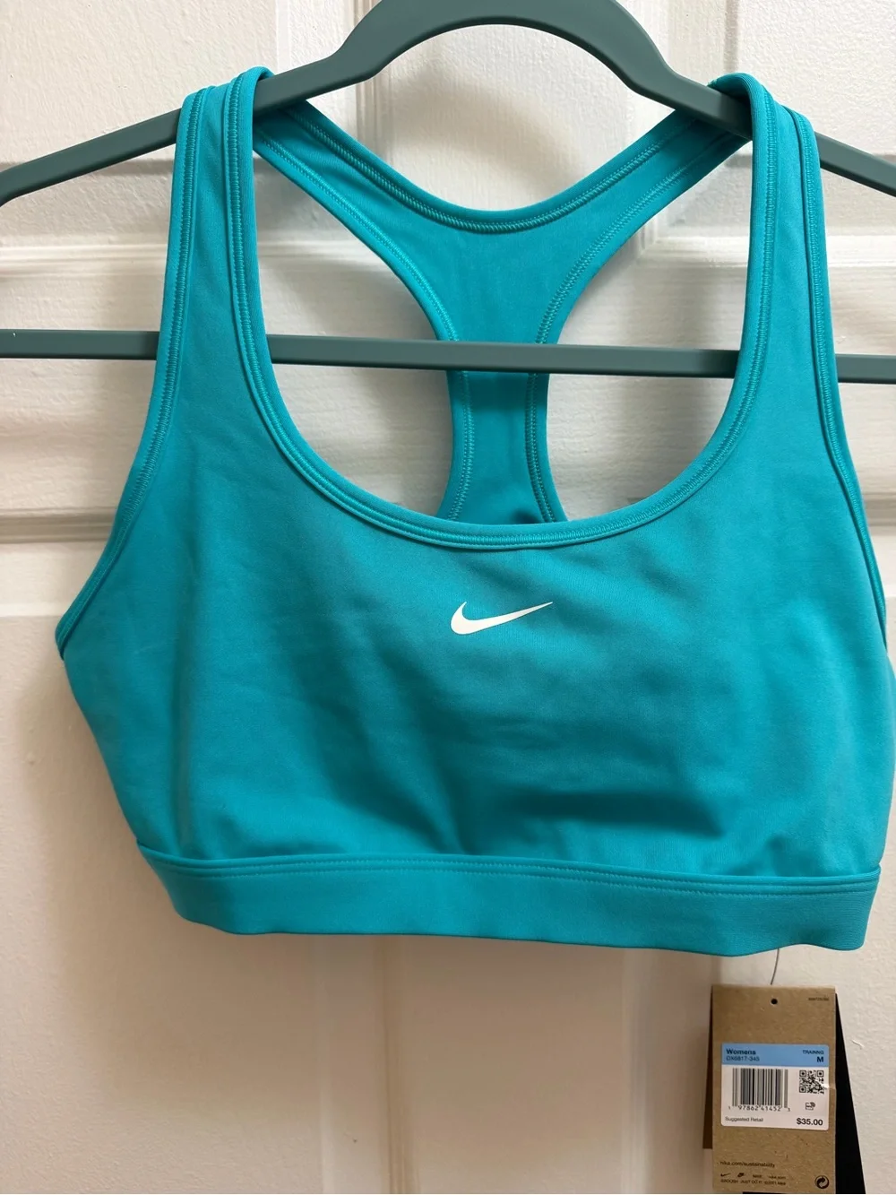 Nike Women’s Teal Sports Bra with White Swoosh